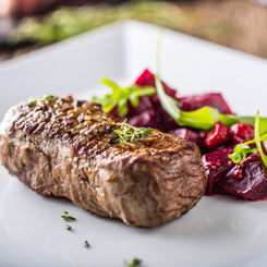 Grilled beef steaks with roast beetroot & walnuts photo