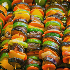 Grilled beef & Mediterranean vegetable skewers photo