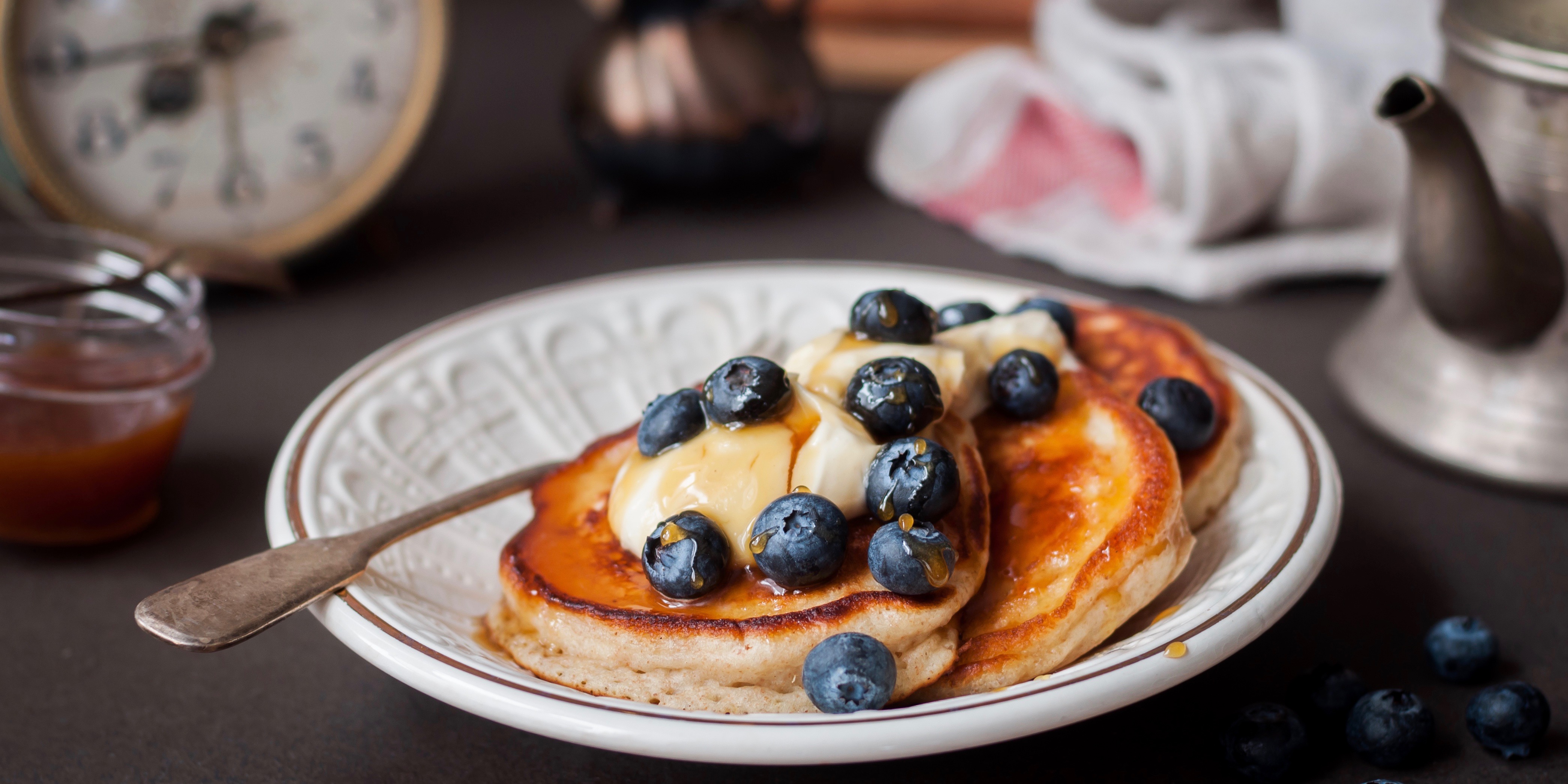 IsoWhey protein pancakes topped with berries and coconut yoghurt photo